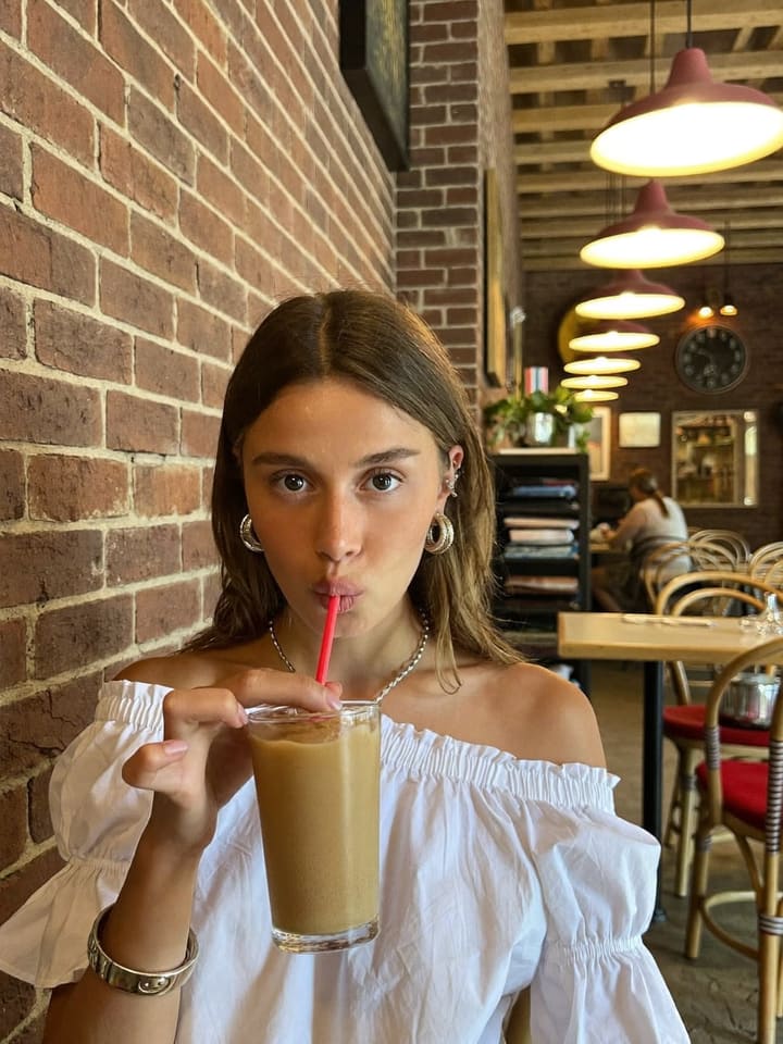 Sip through the straw, look at camera at Silver Lake cafe